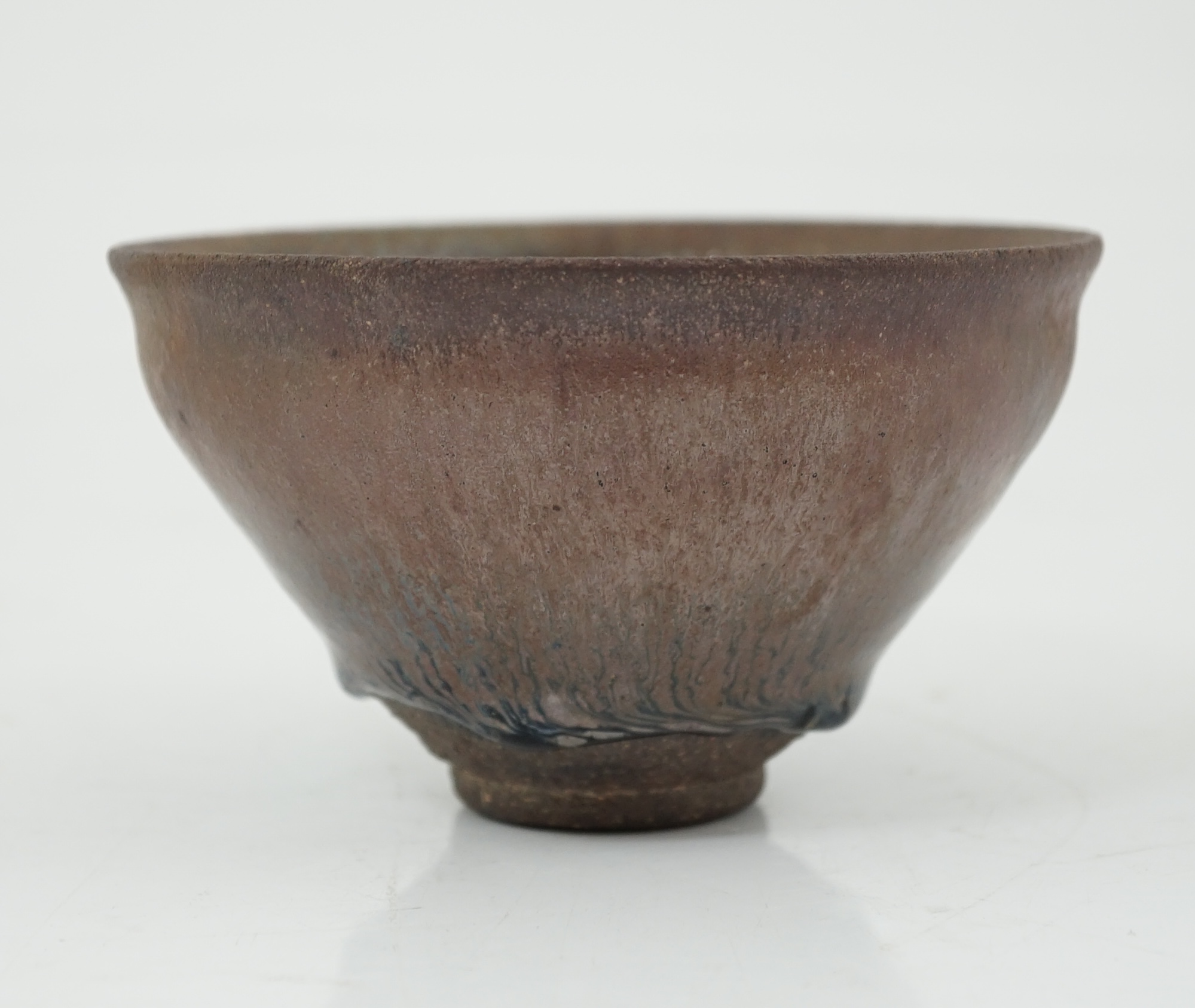 A Chinese 'hares fur' pottery bowl, Song Dynasty with a thick glaze pooling above the unglazed base, 12.2cm diameter. Provenance - Robert Ricketts collection. Condition - good